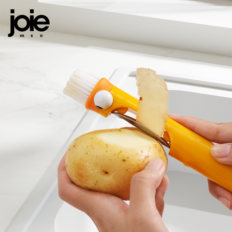 Kitchen Gadgets Joie - مقشرة وفرشاة متعددة الوظائف من جوي،